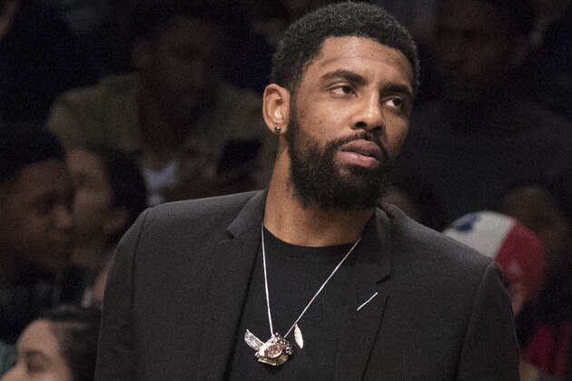 Boston Celtics guard Kyrie Irving watches the game action from the bench during the second half of an NBA basketball game against the Brooklyn Nets, Saturday, March 30, 2019, in New York. The Nets won 110-96. (AP Photo/Mary Altaffer)