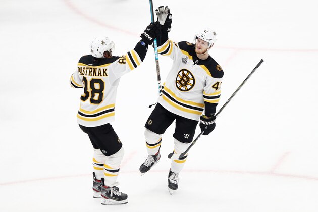 ST LOUIS, MISSOURI - JUNE 01:  Torey Krug #47 of the Boston Bruins is congratulated by his teammate David Pastrnak #88 after scoring a second period goal against the St. Louis Blues in Game Three of the 2019 NHL Stanley Cup Final at Enterprise Center on June 01, 2019 in St Louis, Missouri. (Photo by Jamie Squire/Getty Images)