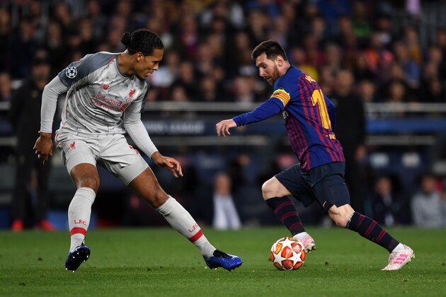 BARCELONA, SPAIN - MAY 01: Lionel Messi of FC Barcelona and Virgil Van Dijk of Liverpool compete for the ball during the UEFA Champions League Semi Final first leg match between Barcelona and Liverpool at the Nou Camp on May 1, 2019 in Barcelona, Spain. (Photo by Etsuo Hara/Getty Images)