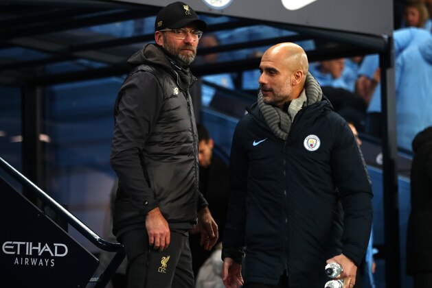 MANCHESTER, ENGLAND - JANUARY 03:  Jurgen Klopp, Manager of Liverpool shakes hands with Josep Guardiola, Manager of Manchester City prior to the Premier League match between Manchester City and Liverpool FC at the Etihad Stadium on January 3, 2019 in Manchester, United Kingdom.  (Photo by Clive Brunskill/Getty Images)