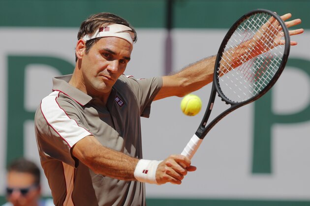 Switzerland's Roger Federer plays a shot against Argentina's Leonardo Mayer during their fourth round match of the French Open tennis tournament at the Roland Garros stadium in Paris, Sunday, June 2, 2019. (AP Photo/Michel Euler)