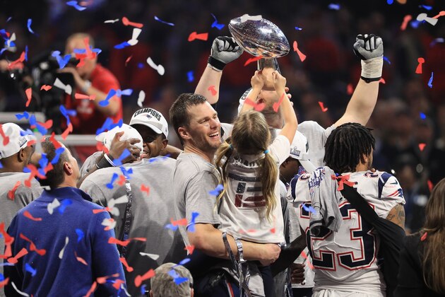 ATLANTA, GA - FEBRUARY 03: Tom Brady #12 of the New England Patriots celebrates with daughter Vivian who raises the Vince Lombardi Trophy after Super Bowl LIII at Mercedes-Benz Stadium on February 3, 2019 in Atlanta, Georgia. The New England Patriots defeat the Los Angeles Rams 13-3.  (Photo by Mike Ehrmann/Getty Images)