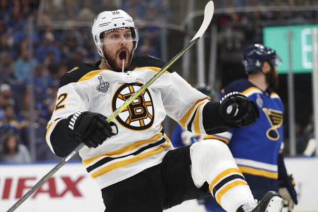 Boston Bruins center Sean Kuraly (52) celebrates after scoring a goal against the St. Louis Blues during the first period of Game 3 of the NHL hockey Stanley Cup Final Saturday, June 1, 2019, in St. Louis. (AP Photo/Jeff Roberson)