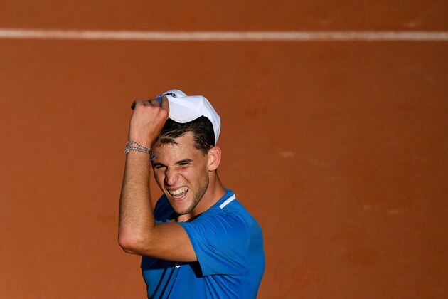 Austria's Dominic Thiem celebrates after winning against Uruguay's Pablo Cuevas during their men's singles third round match on day seven of The Roland Garros 2019 French Open tennis tournament in Paris on June 1, 2019. (Photo by Martin BUREAU / AFP)        (Photo credit should read MARTIN BUREAU/AFP/Getty Images)