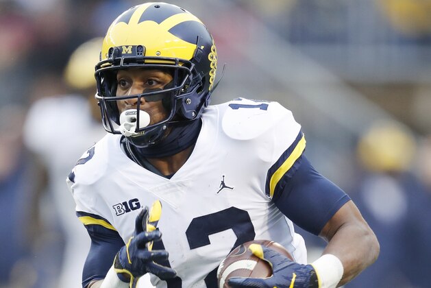 MADISON, WI - NOVEMBER 18: Chris Evans #12 of the Michigan Wolverines runs the ball during a game against the Wisconsin Badgers at Camp Randall Stadium on November 18, 2017 in Madison, Wisconsin. Wisconsin won 24-10. (Photo by Joe Robbins/Getty Images)