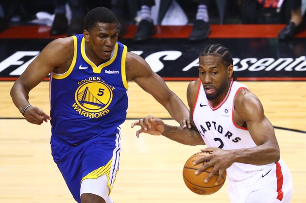 TORONTO, ONTARIO - JUNE 02:  Kawhi Leonard #2 of the Toronto Raptors is defended by Kevon Looney #5 of the Golden State Warriors in the first half during Game Two of the 2019 NBA Finals at Scotiabank Arena on June 02, 2019 in Toronto, Canada.  NOTE TO USER: User expressly acknowledges and agrees that, by downloading and or using this photograph, User is consenting to the terms and conditions of the Getty Images License Agreement. (Photo by Vaughn Ridley/Getty Images)