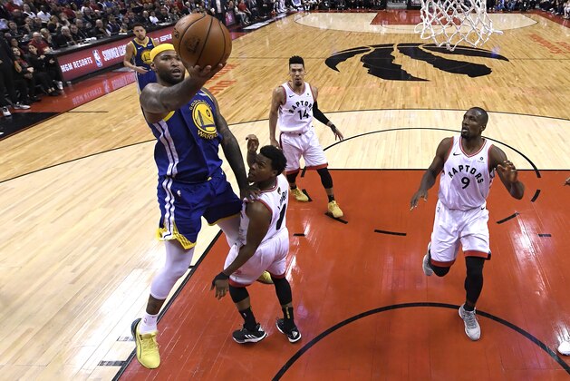 TORONTO, ONTARIO - JUNE 02:  DeMarcus Cousins #0 of the Golden State Warriors attempts a shot against Kyle Lowry #7 of the Toronto Raptors during Game Two of the 2019 NBA Finals at Scotiabank Arena on June 02, 2019 in Toronto, Canada.  NOTE TO USER: User expressly acknowledges and agrees that, by downloading and or using this photograph, User is consenting to the terms and conditions of the Getty Images License Agreement. (Photo by Gregory Shamus/Getty Images)