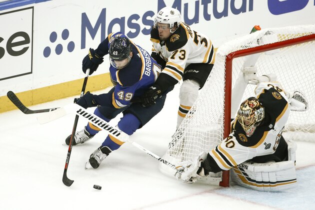 St. Louis Blues center Ivan Barbashev (49), of Russia, circles the net as he is defended by Boston Bruins defenseman Charlie McAvoy (73) and goaltender Tuukka Rask (40), of Finland, during the second period of Game 3 of the NHL hockey Stanley Cup Final Saturday, June 1, 2019, in St. Louis. (AP Photo/Scott Kane)