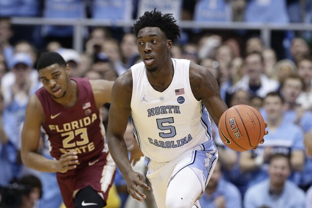 North Carolina's Nassir Little (5) dribbles while Florida State's M.J. Walker (23) chases during the first half of an NCAA college basketball game in Chapel Hill, N.C., Saturday, Feb. 23, 2019. (AP Photo/Gerry Broome)