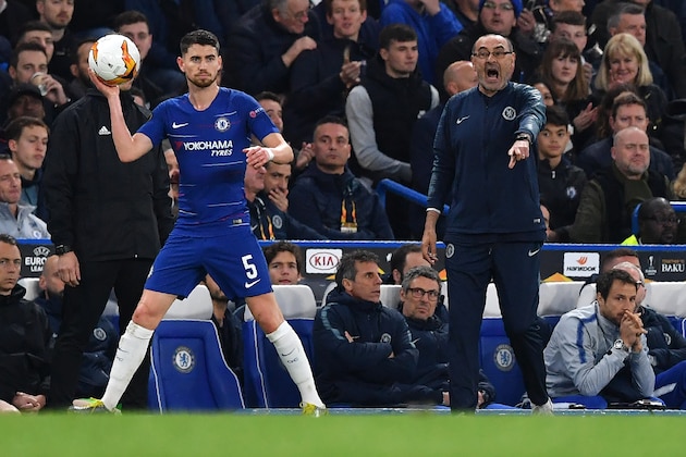 Chelsea's Italian head coach Maurizio Sarri (R) reacts as Chelsea's Italian midfielder Jorginho takes a throw-in during the UEFA Europa League semi-final second leg football match between Chelsea and Eintracht Frankfurt at Stamford Bridge in London on May 9, 2019. (Photo by Ben STANSALL / AFP)        (Photo credit should read BEN STANSALL/AFP/Getty Images)