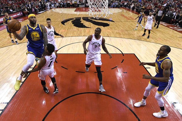 TORONTO, ONTARIO - JUNE 02:  DeMarcus Cousins #0 of the Golden State Warriors attempts a shot against Kyle Lowry #7 of the Toronto Raptors during Game Two of the 2019 NBA Finals at Scotiabank Arena on June 02, 2019 in Toronto, Canada.  NOTE TO USER: User expressly acknowledges and agrees that, by downloading and or using this photograph, User is consenting to the terms and conditions of the Getty Images License Agreement. (Photo by Gregory Shamus/Getty Images)