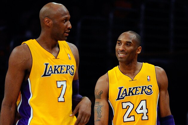 LOS ANGELES, CA - APRIL 20:  Lamar Odom #7 stands next to Kobe Bryant #24 of the Los Angeles Lakers while taking on the New Orleans Hornets in Game Two of the Western Conference Quarterfinals in the 2011 NBA Playoffs on April 20, 2011 at Staples Center in Los Angeles, California. NOTE TO USER: User expressly acknowledges and agrees that, by downloading and or using this photograph, User is consenting to the terms and conditions of the Getty Images License Agreement.  (Photo by Kevork Djansezian/Getty Images)