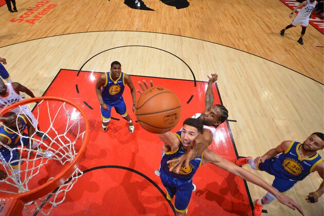 TORONTO, CANADA - JUNE 2: Klay Thompson #11 of the Golden State Warriors and Kawhi Leonard #2 of the Toronto Raptors fight for the rebound during Game Two of the NBA Finals on June 2, 2019 at Scotiabank Arena in Toronto, Ontario, Canada. NOTE TO USER: User expressly acknowledges and agrees that, by downloading and/or using this photograph, user is consenting to the terms and conditions of the Getty Images License Agreement. Mandatory Copyright Notice: Copyright 2019 NBAE (Photo by Jesse D. Garrabrant/NBAE via Getty Images)