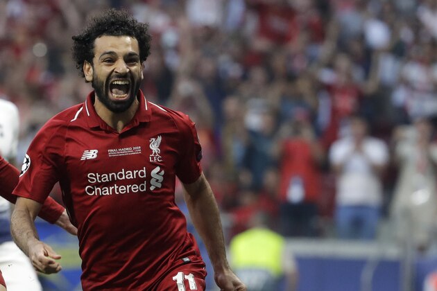 Liverpool's Mohamed Salah celebrates after scoring his side's opening goal during the Champions League final soccer match between Tottenham Hotspur and Liverpool at the Wanda Metropolitano Stadium in Madrid, Saturday, June 1, 2019. (AP Photo/Felipe Dana)
