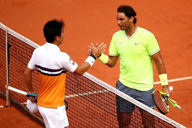PARIS, FRANCE - JUNE 04: Rafael Nadal of Spain shakes hands with Kei Nishikori of Japan following their mens singles quarter-final during Day ten of the 2019 French Open at Roland Garros on June 04, 2019 in Paris, France. (Photo by Julian Finney/Getty Images)