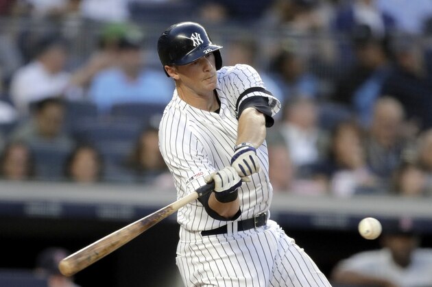 New York Yankees' DJ LeMahieu hits a run-scoring double off Boston Red Sox starting pitcher Chris Sale during the third inning of a baseball game, Friday, May 31, 2019, in New York. Yankees' Gio Urshela scored on the play. (AP Photo/Julio Cortez)
