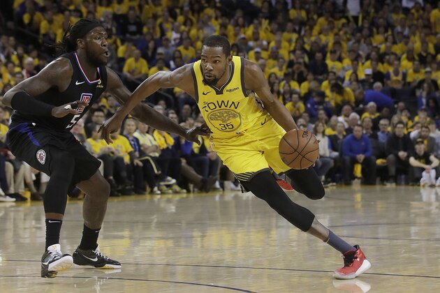 Golden State Warriors forward Kevin Durant (35) drives against Los Angeles Clippers forward Montrezl Harrell (5) during the second half of Game 2 of a first-round NBA basketball playoff series in Oakland, Calif., Monday, April 15, 2019. (AP Photo/Jeff Chiu)