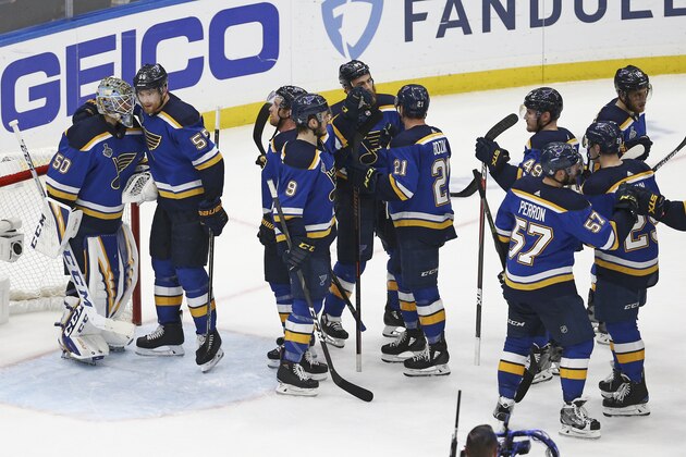 St. Louis Blues players celebrate after beating the Boston Bruins in Game 4 of the NHL hockey Stanley Cup Final Monday, June 3, 2019, in St. Louis. The Blues won 4-2 to even the series 2-2. (AP Photo/Scott Kane)
