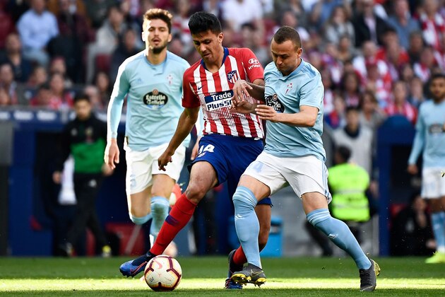 Atletico Madrid's Spanish midfielder Rodri (L) challenges Celta Vigo's Slovak milfielder Stanislav Lobotka during the Spanish league football match between Club Atletico de Madrid and RC Celta de Vigo at the Wanda Metropolitano stadium in Madrid on April 13, 2019. (Photo by PIERRE-PHILIPPE MARCOU / AFP)        (Photo credit should read PIERRE-PHILIPPE MARCOU/AFP/Getty Images)