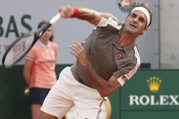 PARIS, FRANCE - JUNE 4: Roger Federer of Switzerland in action against Stanislas Wawrinka of Switzerland in their quarter final during day 10 of the 2019 French Open at Roland Garros stadium on June 4, 2019 in Paris, France. (Photo by Jean Catuffe/Getty Images)