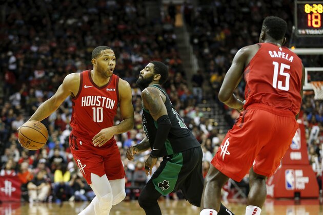 HOUSTON, TX - DECEMBER 27:  Eric Gordon #10 of the Houston Rockets dribbles the ball defended by Kyrie Irving #11 of the Boston Celtics in the second half at Toyota Center on December 27, 2018 in Houston, Texas.  NOTE TO USER: User expressly acknowledges and agrees that, by downloading and or using this photograph, User is consenting to the terms and conditions of the Getty Images License Agreement.  (Photo by Tim Warner/Getty Images)