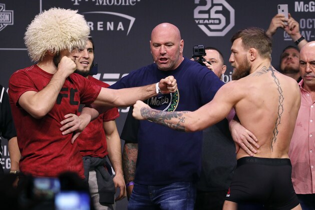 Conor McGregor, right, and Khabib Nurmagomedov face off during a ceremonial weigh-in for the UFC 229 mixed martial arts fight Friday, Oct. 5, 2018, in Las Vegas. (AP Photo/John Locher)