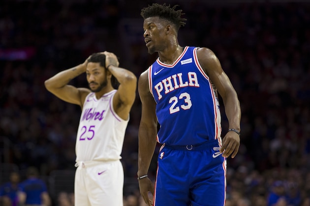 PHILADELPHIA, PA - JANUARY 15: Jimmy Butler #23 of the Philadelphia 76ers and Derrick Rose #25 of the Minnesota Timberwolves look on at the Wells Fargo Center on January 15, 2019 in Philadelphia, Pennsylvania. NOTE TO USER: User expressly acknowledges and agrees that, by downloading and or using this photograph, User is consenting to the terms and conditions of the Getty Images License Agreement. (Photo by Mitchell Leff/Getty Images)
