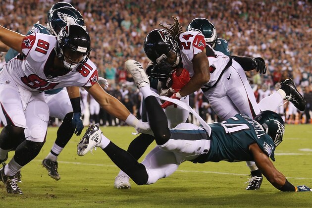 PHILADELPHIA, PA - SEPTEMBER 06:  Jordan Hicks #58 and Kamu Grugier-Hill #54 of the Philadelphia Eagles tackle Devonta Freeman #24 of the Atlanta Falcons short of the goal line during the first half at Lincoln Financial Field on September 6, 2018 in Philadelphia, Pennsylvania.  (Photo by Mitchell Leff/Getty Images)