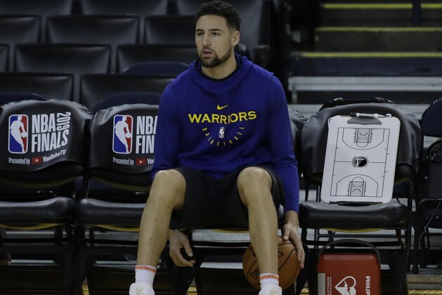Golden State Warriors' Klay Thompson sits on the bench during practice for the NBA Finals against the Toronto Raptors Tuesday, June 4, 2019, in Oakland, Calif. Game 3 of the NBA Finals is Wednesday, June 5, 2019 in Oakland, Calif. (AP Photo/Ben Margot)