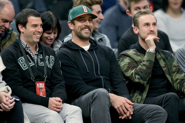 MILWAUKEE, WISCONSIN - APRIL 10:  Aaron Rodgers of the Green Bay Packers looks on during the game between the Oklahoma City Thunder and Milwaukee Bucks at the Fiserv Forum on April 10, 2019 in Milwaukee, Wisconsin. NOTE TO USER: User expressly acknowledges and agrees that, by downloading and or using this photograph, User is consenting to the terms and conditions of the Getty Images License Agreement. (Photo by Dylan Buell/Getty Images)
