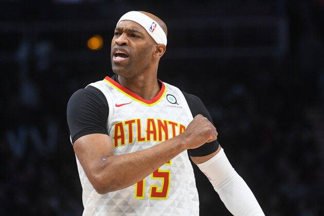 Atlanta Hawks forward Vince Carter reacts after making a three-point basket during the first half of an NBA basketball game against the Utah Jazz, Thursday, March 21, 2019, in Atlanta. (AP Photo/John Amis)