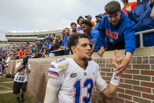 Florida quarterback Feleipe Franks (13) gets congratulated by fans after defeating Florida State 41-14 in an NCAA college football game in Tallahassee, Fla., Saturday, Nov. 24, 2018. (AP Photo/Mark Wallheiser)