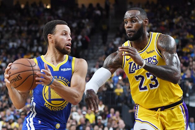 LAS VEGAS, NEVADA - OCTOBER 10:  Stephen Curry #30 of the Golden State Warriors drives against LeBron James #23 of the Los Angeles Lakers during their preseason game at T-Mobile Arena on October 10, 2018 in Las Vegas, Nevada. The Lakers defeated the Warriors 123-113. NOTE TO USER: User expressly acknowledges and agrees that, by downloading and or using this photograph, User is consenting to the terms and conditions of the Getty Images License Agreement.  (Photo by Ethan Miller/Getty Images)
