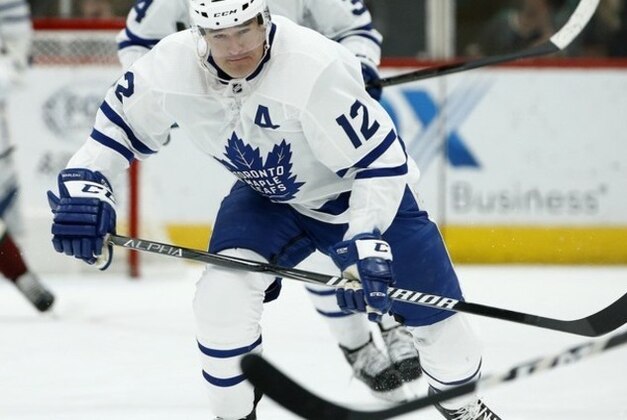 Toronto Maple Leafs center Patrick Marleau skates to the puck against the Arizona Coyotes during the first period of an NHL hockey game Saturday, Feb. 16, 2019, in Glendale, Ariz. (AP Photo/Ross D. Franklin)