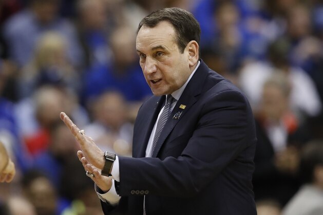 Duke head coach Mike Krzyzewski talks to his players during the second half of an NCAA men's East Regional final college basketball game against Michigan State in Washington, Sunday, March 31, 2019. (AP Photo/Alex Brandon)
