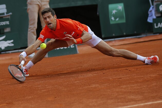 Serbia's Novak Djokovic plays a shot against Germany's Alexander Zverev during their quarterfinal match of the French Open tennis tournament at the Roland Garros stadium in Paris, Thursday, June 6, 2019. (AP Photo/Michel Euler)