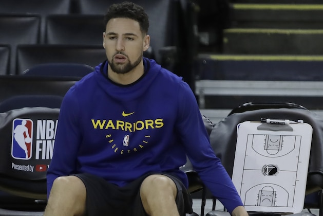 Golden State Warriors' Klay Thompson sits on the bench during practice for the NBA Finals against the Toronto Raptors Tuesday, June 4, 2019, in Oakland, Calif. Game 3 of the NBA Finals is Wednesday, June 5, 2019 in Oakland, Calif. (AP Photo/Ben Margot)