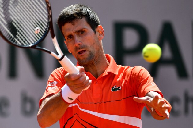 Serbia's Novak Djokovic returns the ball to Germany's Alexander Zverev during their men's singles quarter-final match on day twelve of The Roland Garros 2019 French Open tennis tournament in Paris on June 6, 2019. (Photo by Martin BUREAU / AFP)        (Photo credit should read MARTIN BUREAU/AFP/Getty Images)