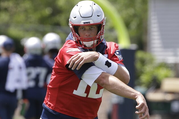New England Patriots quarterback Tom Brady follows through after throwing the ball during an NFL football minicamp practice, Tuesday, June 4, 2019, in Foxborough, Mass. (AP Photo/Steven Senne)