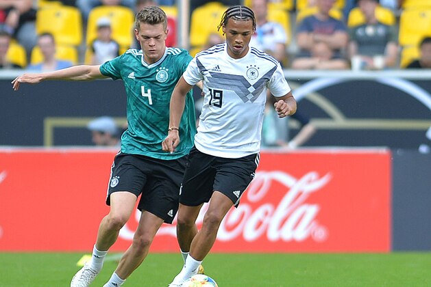 AACHEN, GERMANY - JUNE 05: Matthias Ginter of Germany and Leroy Sane of Germany battle for the ball during the Germany internal test match at Tivoli Stadium on June 05, 2019 in Aachen, Germany. (Photo by TF-Images/Getty Images)