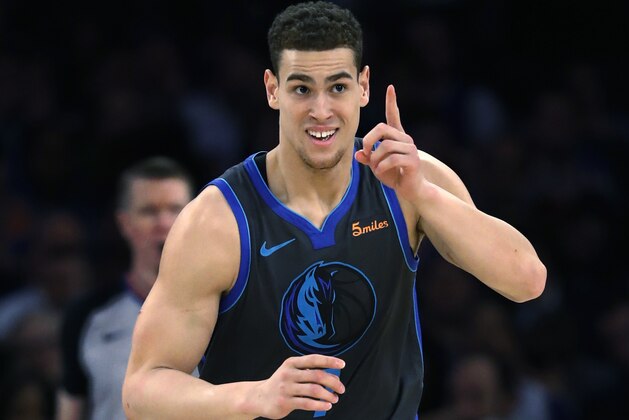 Dallas Mavericks forward Dwight Powell gestures toward his team's bench after dunking during the second half of the team's NBA basketball game Wednesday, Jan. 30, 2019, in New York. The Mavericks won 114-90. (AP Photo/Kathy Willens)