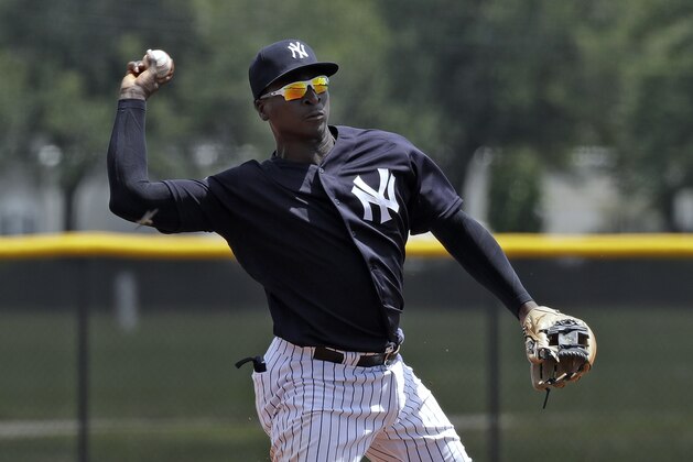 New York Yankees' Didi Gregorius throws the ball to first base in time to get a runner during a Gulf Coast League baseball game Monday, May 20, 2019, in Tampa, Fla. Gregorius is playing for the first time since having Tommy John surgery. (AP Photo/Chris O'Meara)
