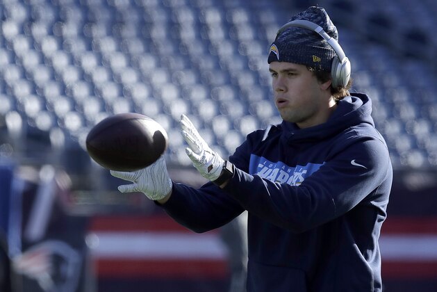 Los Angeles Chargers tight end Hunter Henry warms up before an NFL divisional playoff football game against the New England Patriots, Sunday, Jan. 13, 2019, in Foxborough, Mass. (AP Photo/Charles Krupa)