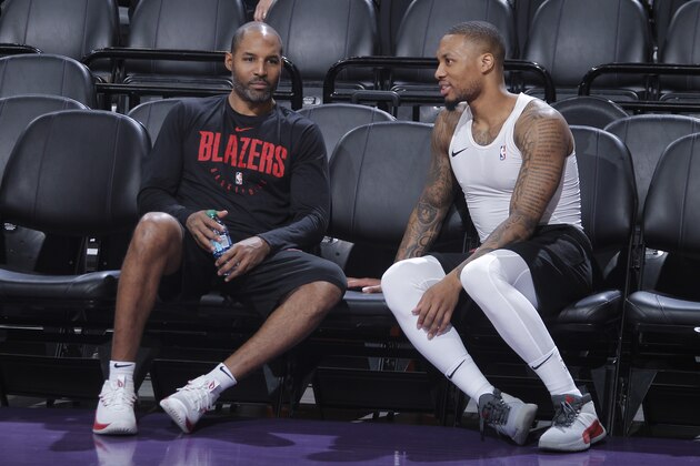 SACRAMENTO, CA - JANUARY 14: Assistant coach David Vanterpool and Damian Lillard #0 of the Portland Trail Blazers talk during the game against the Sacramento Kings on January 14, 2019 at Golden 1 Center in Sacramento, California. NOTE TO USER: User expressly acknowledges and agrees that, by downloading and or using this photograph, User is consenting to the terms and conditions of the Getty Images Agreement. Mandatory Copyright Notice: Copyright 2019 NBAE (Photo by Rocky Widner/NBAE via Getty Images)