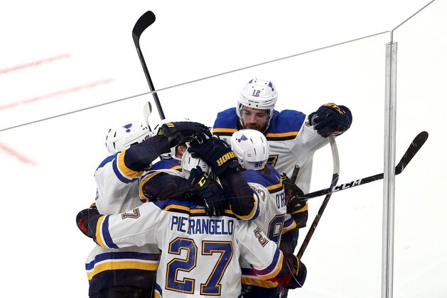 BOSTON, MASSACHUSETTS - JUNE 06:  Ryan O'Reilly #90 of the St. Louis Blues is congratulated by his teammates after scoring a second period goal against the Boston Bruins in Game Five of the 2019 NHL Stanley Cup Final at TD Garden on June 06, 2019 in Boston, Massachusetts. (Photo by Patrick Smith/Getty Images)