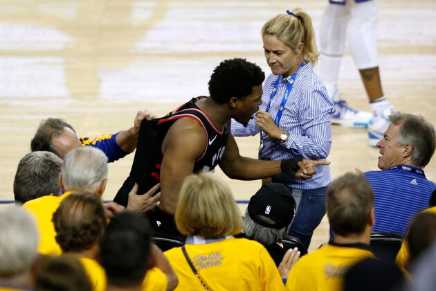 OAKLAND, CALIFORNIA - JUNE 05:  Kyle Lowry #7 of the Toronto Raptors argues with Warriors minority investor Mark Stevens (blue shirt) after Lowry chased down a loose ball in the second half against the Golden State Warriors during Game Three of the 2019 NBA Finals at ORACLE Arena on June 05, 2019 in Oakland, California. According to to the Warriors, Stevens will not be in attendance for the remainder of the NBA Finals as they look further into the incident. NOTE TO USER: User expressly acknowledges and agrees that, by downloading and or using this photograph, User is consenting to the terms and conditions of the Getty Images License Agreement. (Photo by Lachlan Cunningham/Getty Images)
