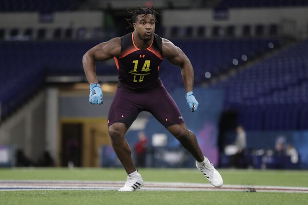 Texas A&M linebacker Tyrel Dodson runs a drill at the NFL football scouting combine in Indianapolis, Sunday, March 3, 2019. (AP Photo/Michael Conroy)