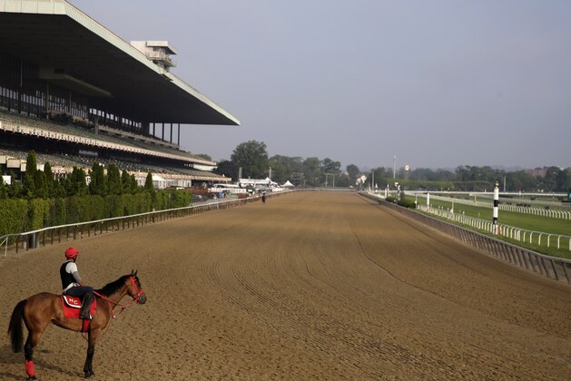 A rider looks out over a mostly empty track during workouts at Belmont Park in Elmont, N.Y., Thursday, June 6, 2019. The 151st Belmont Stakes horse race will be run on Saturday, June 8, 2019. (AP Photo/Seth Wenig)