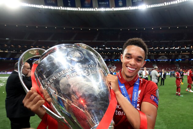 MADRID, SPAIN - JUNE 01: Trent Alexander-Arnold of Liverpool poses with the trophy during the UEFA Champions League Final between Tottenham Hotspur and Liverpool at Estadio Wanda Metropolitano on June 1, 2019 in Madrid, Spain. (Photo by Marc Atkins/Getty Images)
