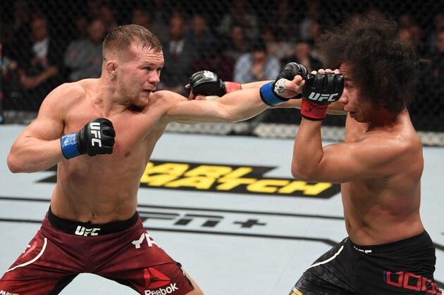 PRAGUE, CZECH REPUBLIC - FEBRUARY 23:  (L-R) Petr Yan of Russia punches John Dodson in their bantamweight bout during the UFC Fight Night event at O2 Arena on February 23, 2019 in the Prague, Czech Republic. (Photo by Jeff Bottari/Zuffa LLC/Zuffa LLC via Getty Images)
